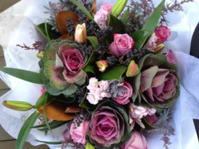 Mystic Mauve - Roses, Kale, stock, mixed foliage and berries and Lillies