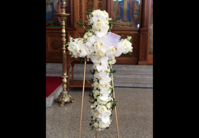 Faithful - Quality flowers beautifully arranged into the shape of a cross colours and flower choice upon request.